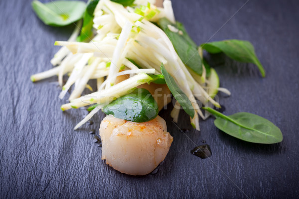 Scallop salad with apple, spinach on a stone plate. Stock photo © user_11224430