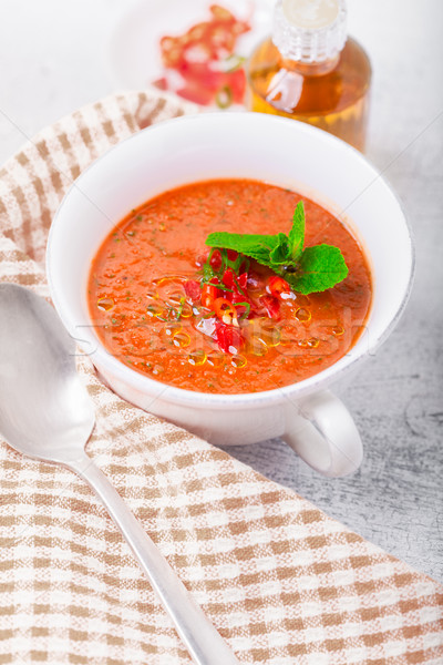 Bowl of fresh tomato soup gazpacho on a napkin Stock photo © user_11224430