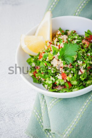 Quinoa tabbouleh salad on a wooden table Stock photo © user_11224430