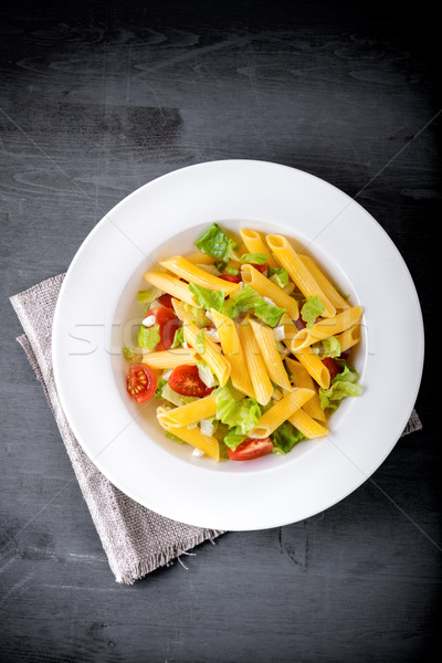 Pasta salad with fresh greenery and tomatos. Stock photo © user_11224430