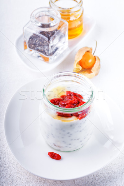 Yaourt baies semences miel déjeuner dessert Photo stock © user_11224430