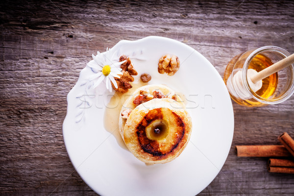 Baked apple with nuts and raisins Stock photo © user_11224430