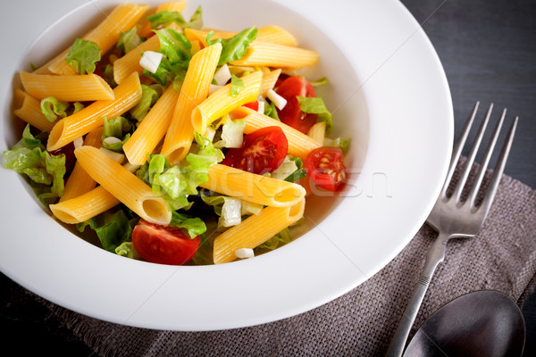 Pasta salad with fresh greenery and tomatos. Stock photo © user_11224430