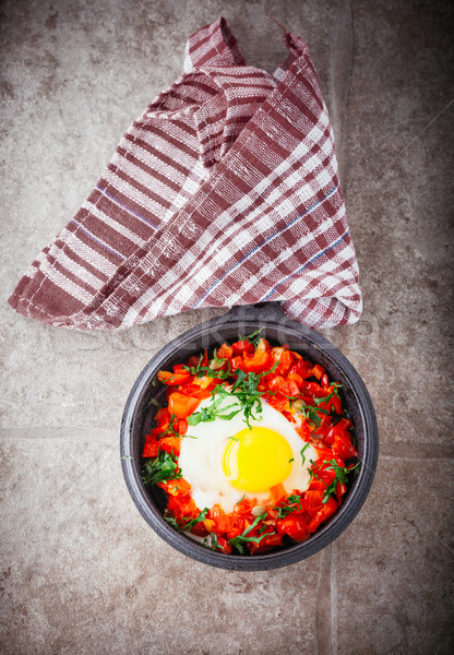 Traditional Middle Eastern dish of Shakshuka in a pan. Stock photo © user_11224430