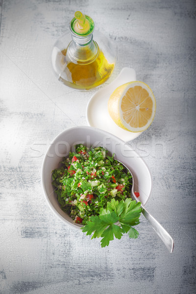 Quinoa tabbouleh salad on a wooden table Stock photo © user_11224430
