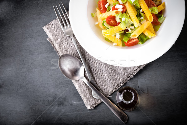 Pasta salad with fresh greenery and tomatos. Stock photo © user_11224430