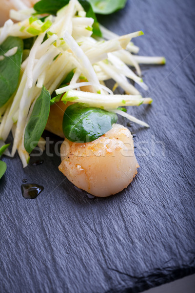 Scallop salad with apple, spinach on a stone plate. Stock photo © user_11224430
