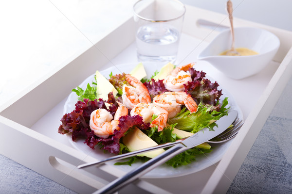 Stock photo: Avocado shrimp salad with mustard sauce on a tray