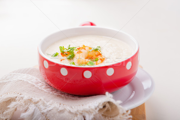 A bowl of creamy cauliflower soup with shrimps. Stock photo © user_11224430