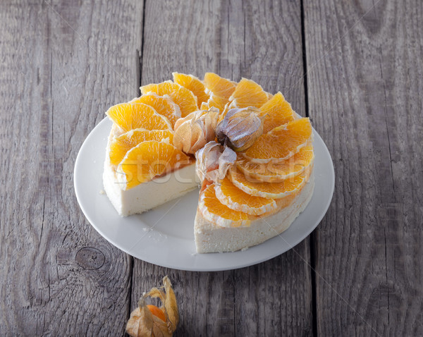 Cheesecake decorated with oranges and physalis Stock photo © user_11224430