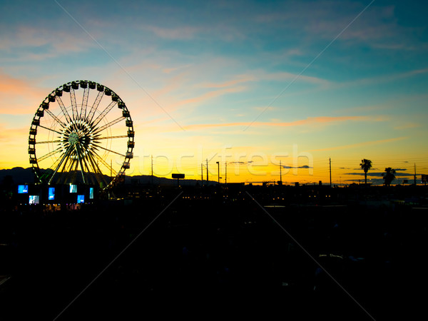 Detail And Silhouette of Ferris Wheel with Sun Set Stock photo © user_9323633