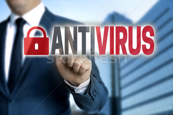 Antivirus touchscreen is operated by businessman Stock photo © user_9870494