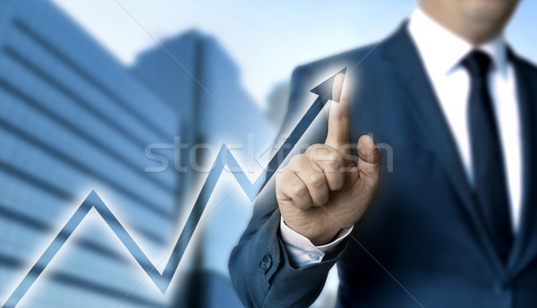 Stock photo: Graph touchscreen is operated by businessman