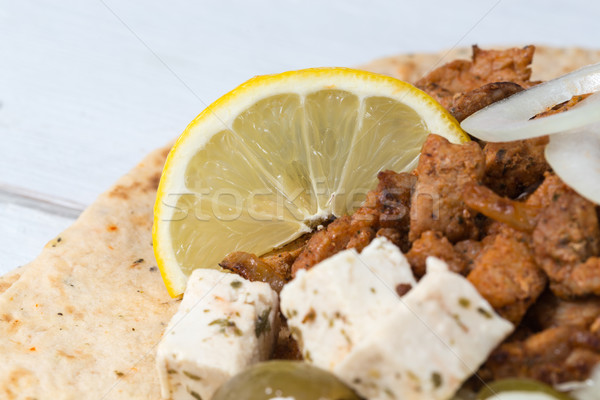 Gyros pita with tzatziki coleslaw olives and feta cheese Stock photo © user_9870494