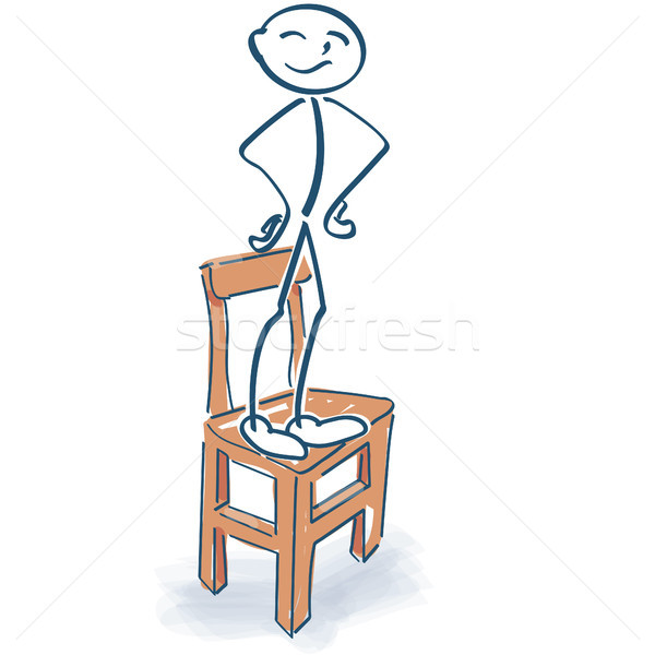 Stock photo: Stick figure stands proudly on the chair