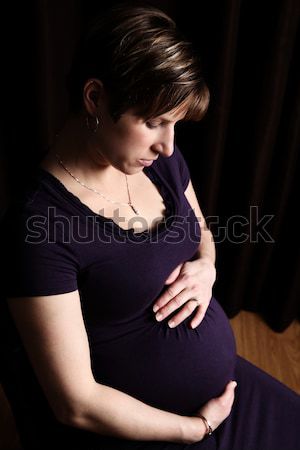Embarazo mujer embarazada oscuro desigual iluminación cuerpo Foto stock © vanessavr