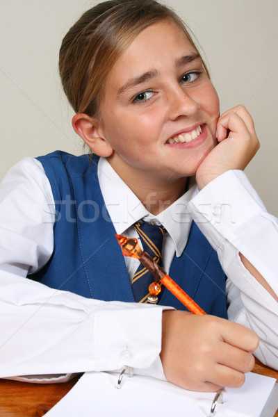 Iskolás lány tini elfoglalt házi feladat visel egyenruha Stock fotó © vanessavr