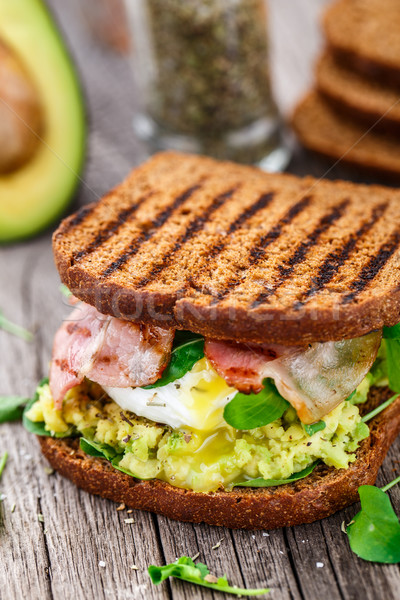 Sandwich with avocado and poached egg Stock photo © vankad