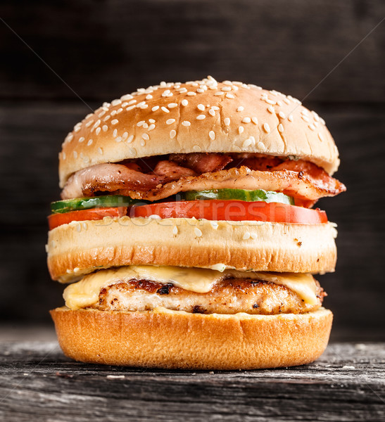 Double burger with chicken, bacon and vegetables Stock photo © vankad