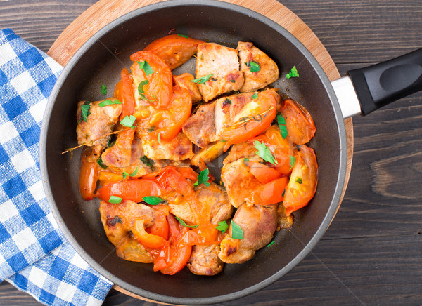 Stock photo: Fried pork with pan-roasted tomatoes