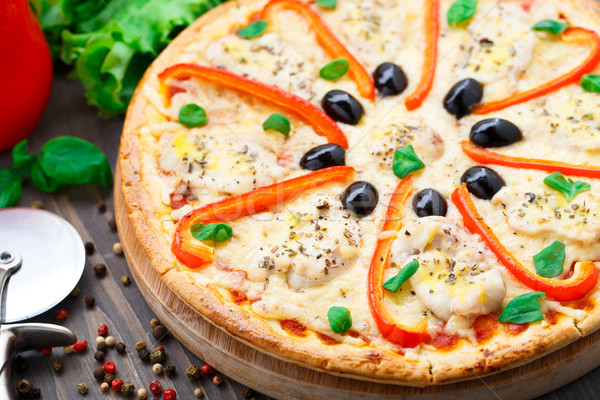 Pizza with chicken, pepper and olives Stock photo © vankad