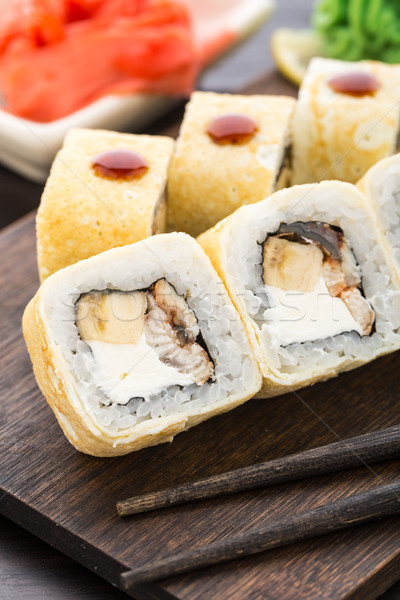 Sushi rolls with smoked eel and banana Stock photo © vankad