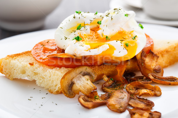 Poached egg with mushrooms and tomatoes Stock photo © vankad