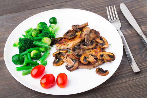 Grilled steak with mushrooms and vegetables Stock photo © vankad