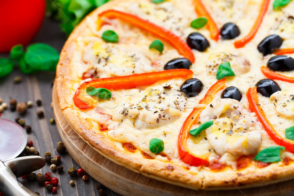 Pizza with chicken, pepper and olives Stock photo © vankad