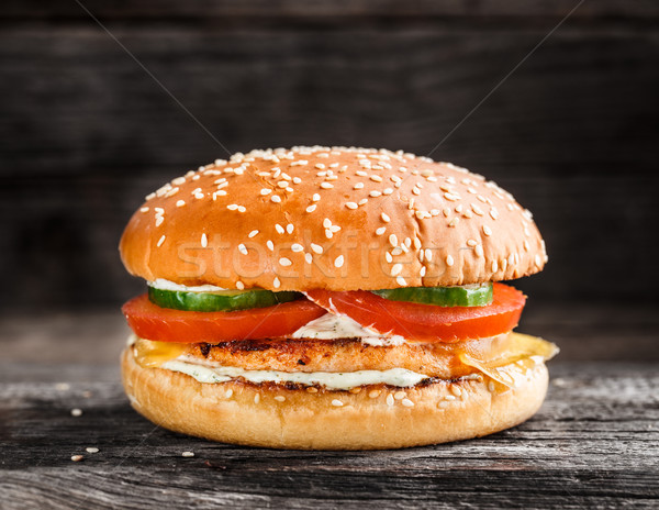 Burger with salmon patty and vegetables Stock photo © vankad