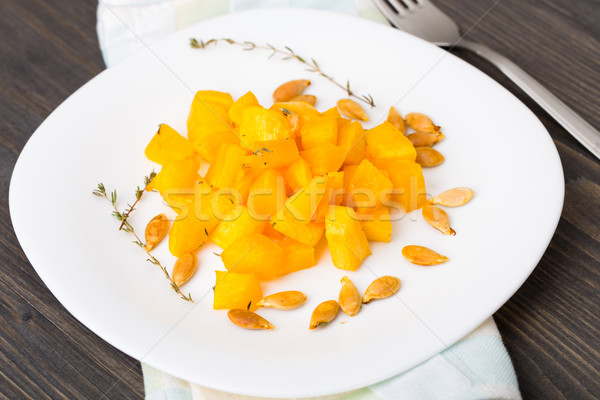 Baked pumpkin with olive oil and thyme Stock photo © vankad