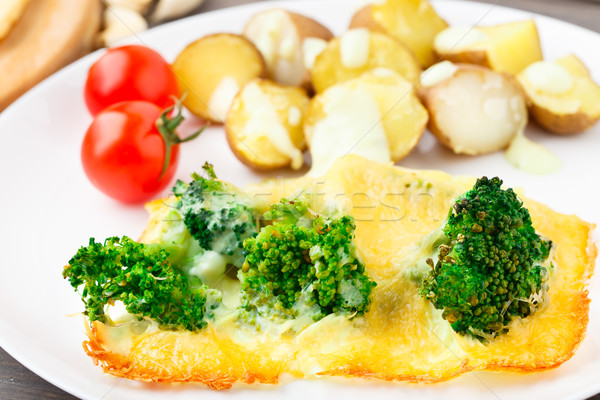 Broccoli gratin with cheese and baked potato Stock photo © vankad
