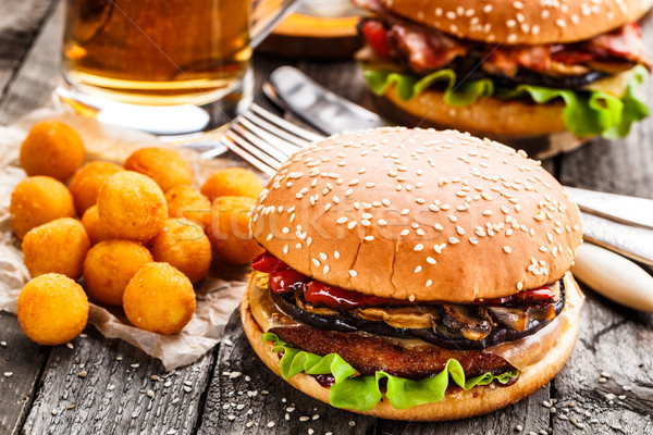 Delicious burger with fried potato balls and beer Stock photo © vankad
