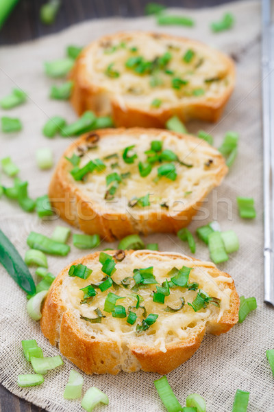 Bruschetta with cheese and scallion Stock photo © vankad