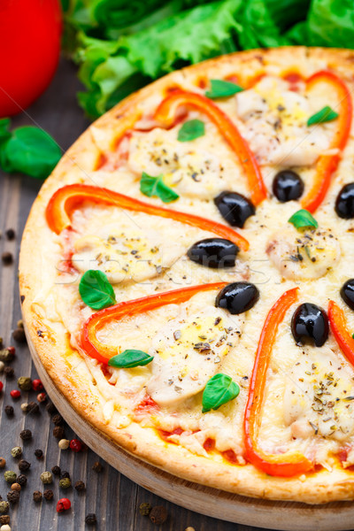 Pizza with chicken, pepper and olives Stock photo © vankad