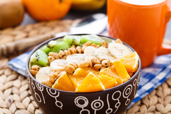 Granola with tropical fruits Stock photo © vankad