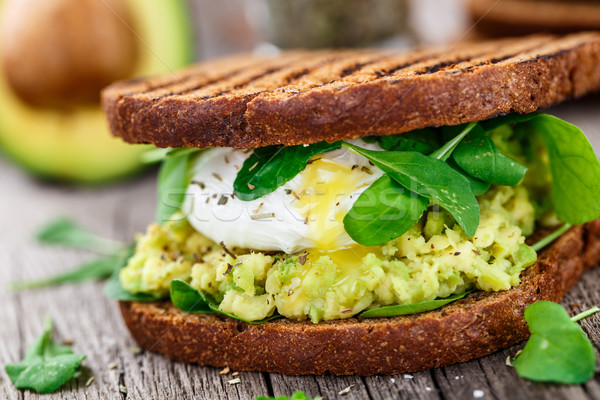 Sandwich with avocado and poached egg Stock photo © vankad