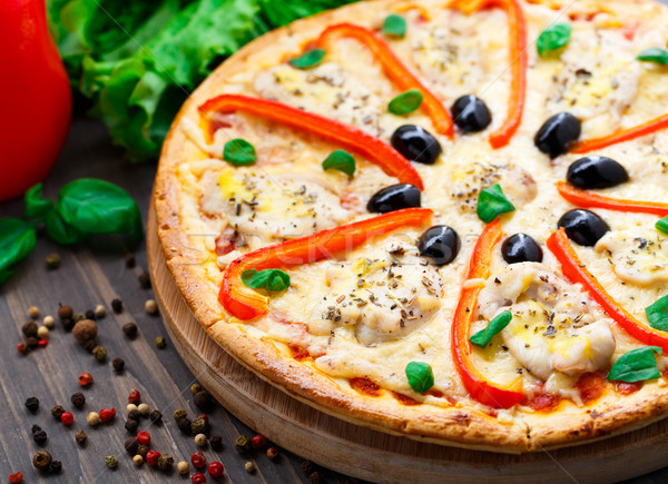 Pizza with chicken, pepper and olives Stock photo © vankad