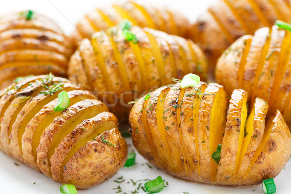 Accordion baked potatoes Stock photo © vankad