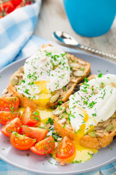 Sandwich with poached egg and cherry tomatoes Stock photo © vankad