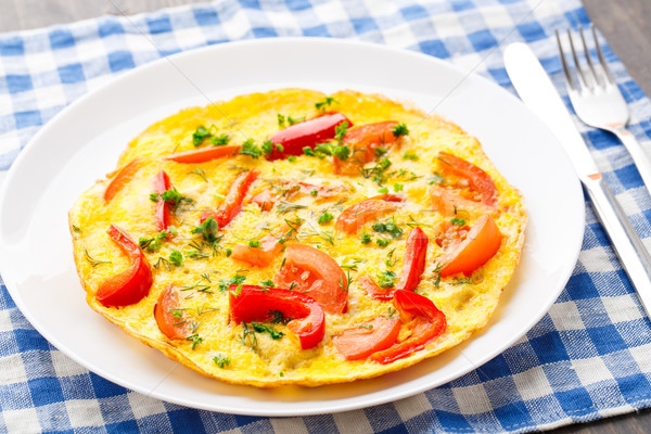 Omelet with paprika, tomato and herbs Stock photo © vankad