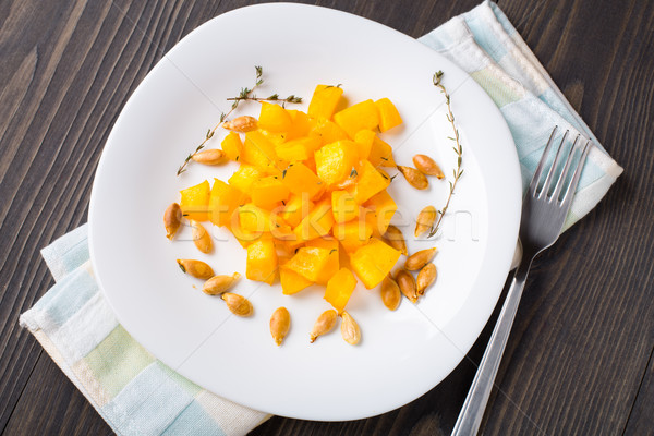 Baked pumpkin with olive oil and thyme Stock photo © vankad