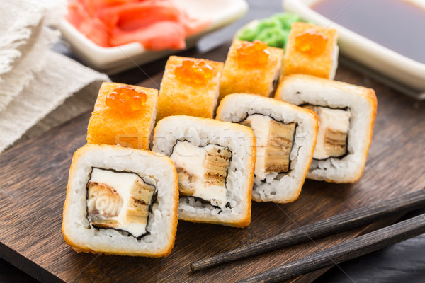 Fried sushi roll with eel and japanese omelette Stock photo © vankad