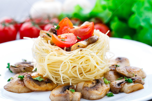 Pasta with cherry tomato and mushrooms Stock photo © vankad