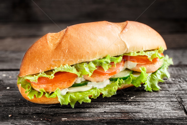 Sandwich with salmon patty and vegetables Stock photo © vankad