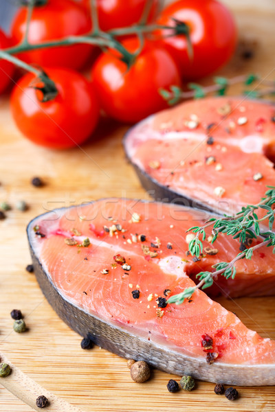Salmon steak with thyme and pepper Stock photo © vankad