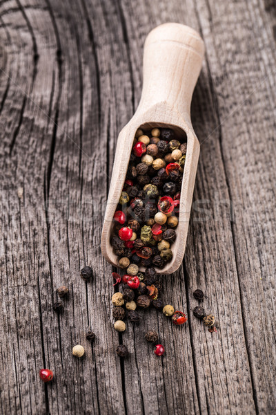 Wooden spoon full of mix pepper Stock photo © vankad