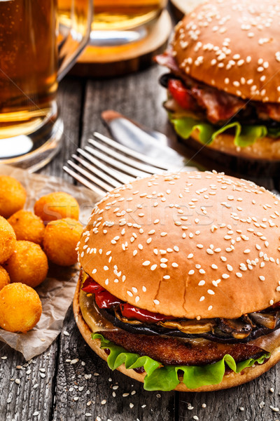 Delicious burger with fried potato balls and beer Stock photo © vankad