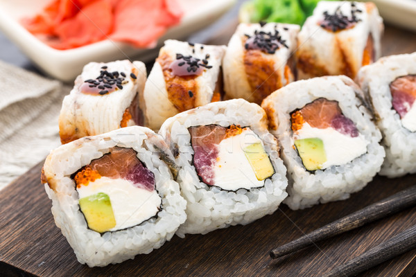 Stock photo: Sushi roll with salmon, tuna and eel