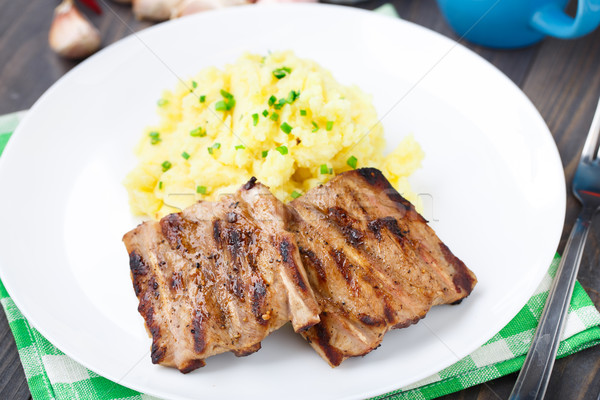 Stock photo: Grilled ribs with mashed potato